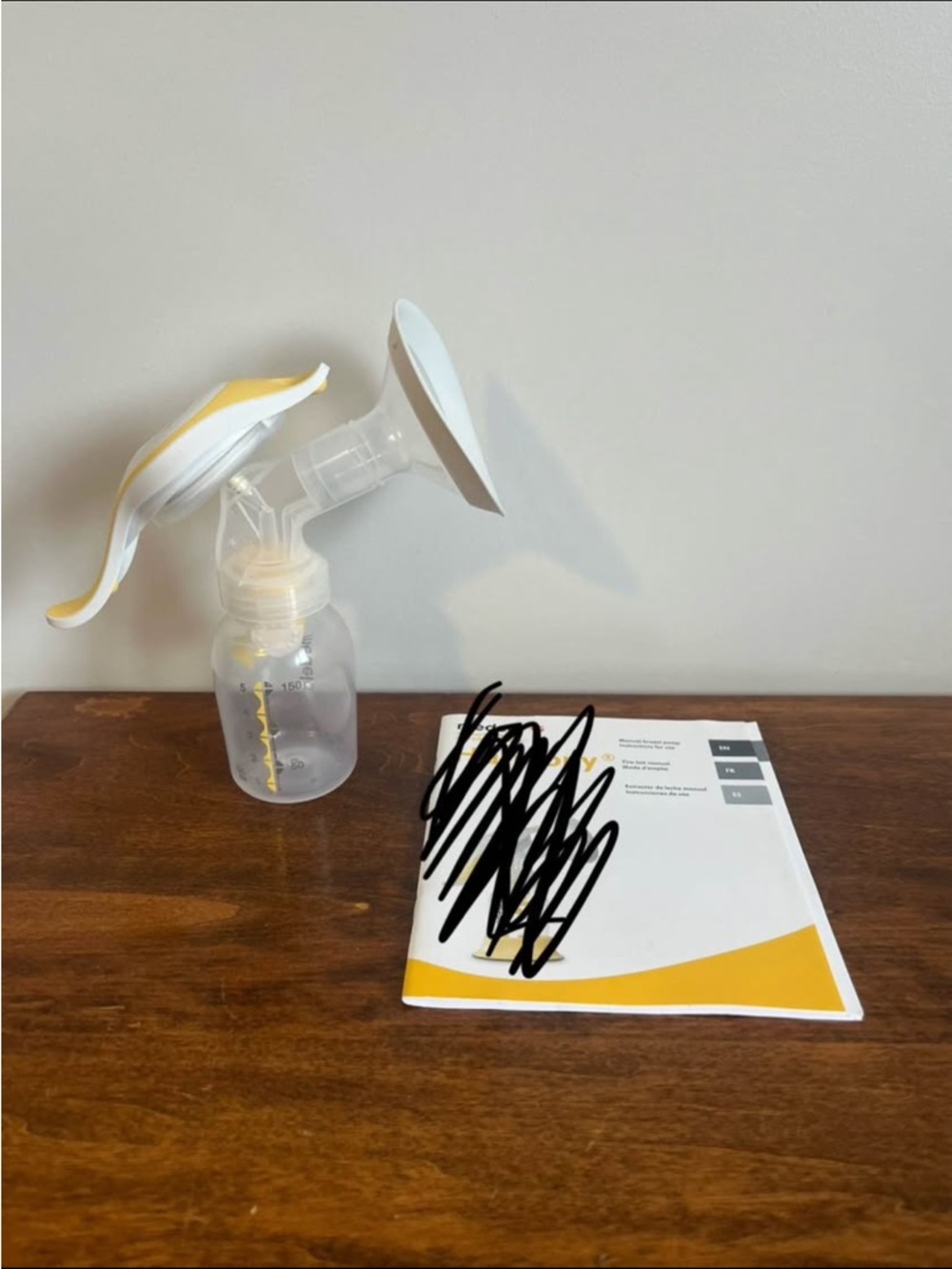 Medela White and Yellow Manual Breast Pump